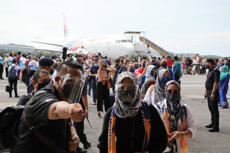 Tourists arrive at the airport as Langkawi reopens to domestic