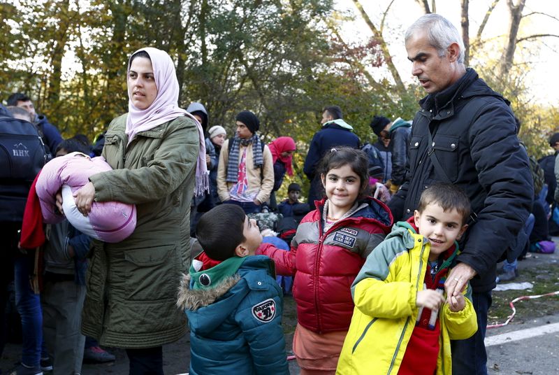 FILE PHOTO: Syrian migrants Khalil arrives with wife and children