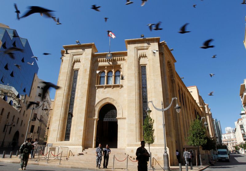 Lebanese policeman stand outside the parliament building in downtown Beirut