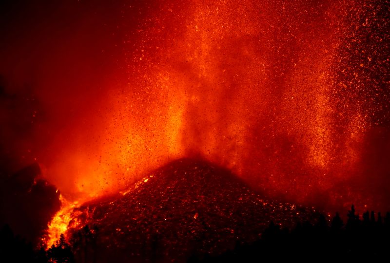 FILE PHOTO: Lava rises downhill following the eruption of a