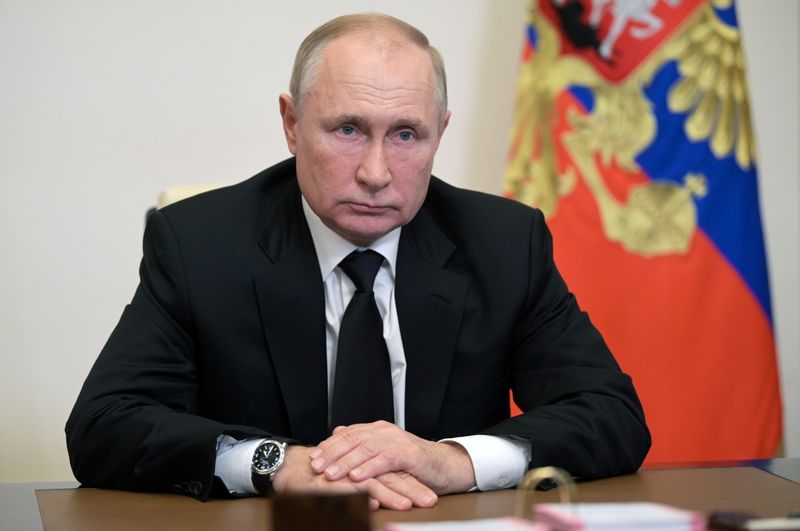 Russian President Vladimir Putin attends a meeting with head of