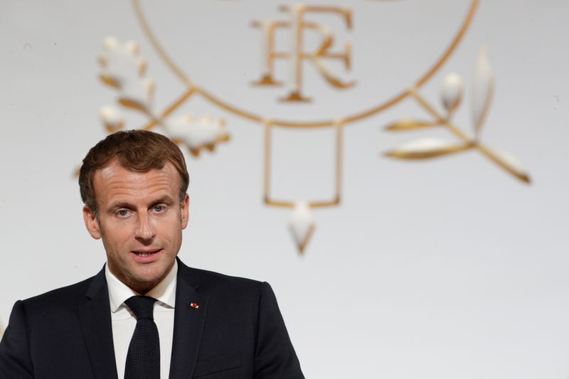 French President Emmanuel Macron delivers a speech during a collective