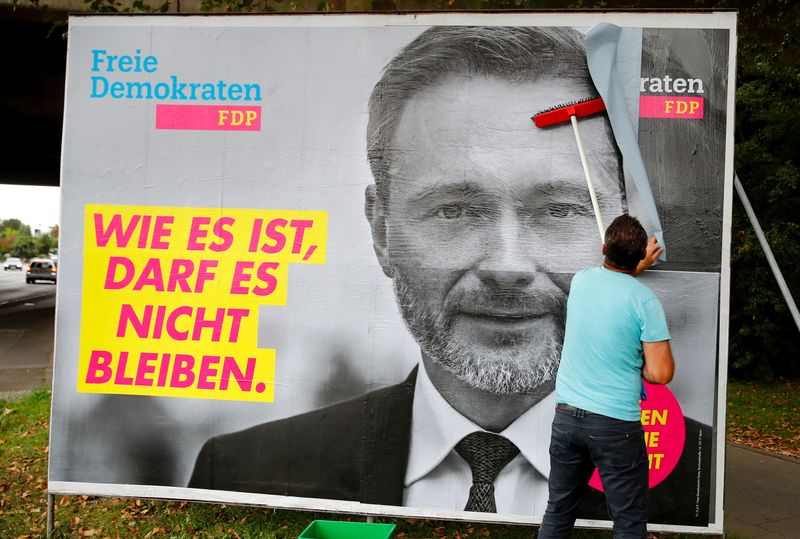 Placards being placed on boards in Bonn for Germany’s general