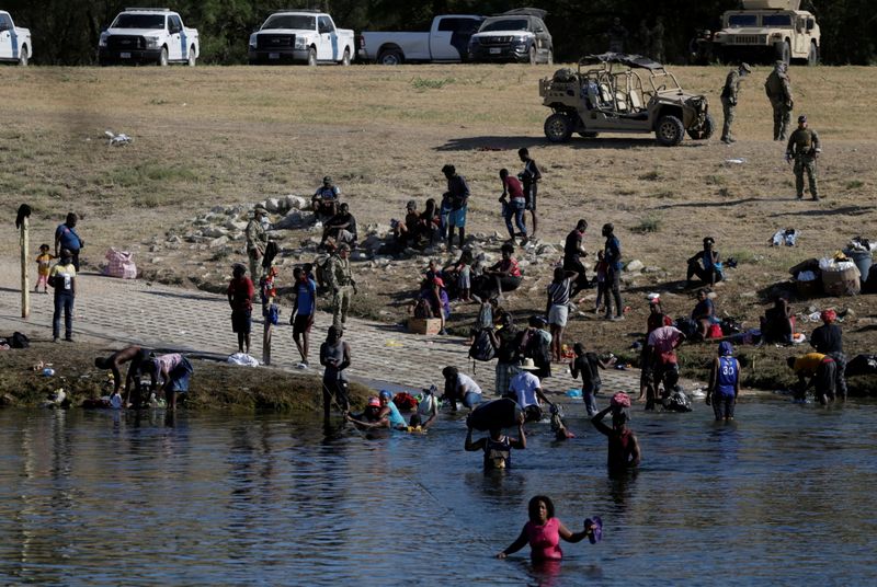 Migrants seeking refuge in the U.S. cross Rio Grande river,