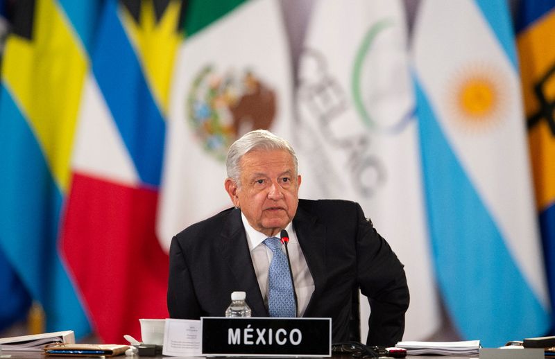 Mexico President Andres Manuel Lopez Obrador listens during the summit