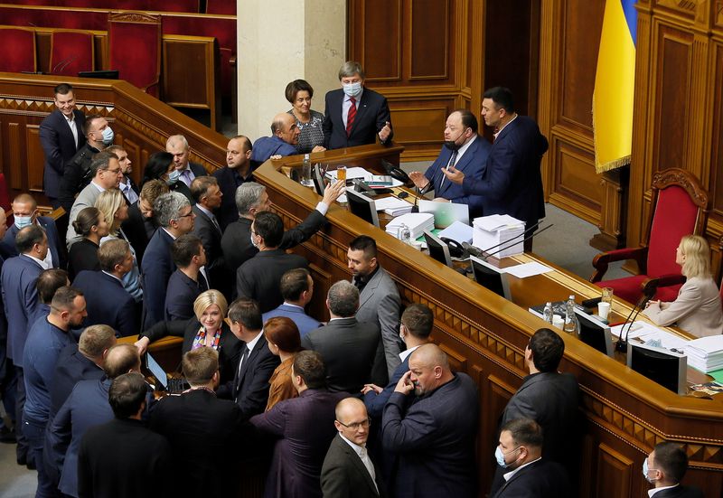 Opposition lawmakers argue with the first deputy parliament speaker Ruslan