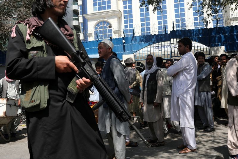 FILE PHOTO: A Taliban security member holding a rifle ensures