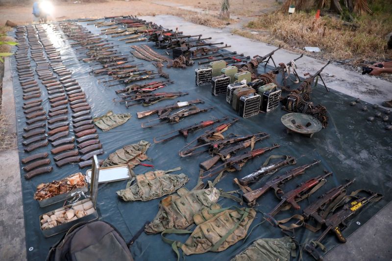 Weapons and ammunition retrieved from militants are displayed by the