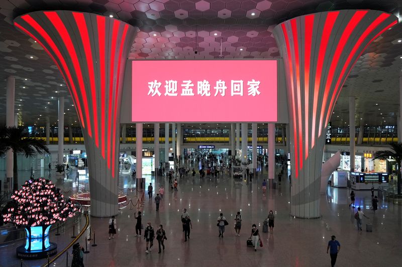 Screen displays welcome message before Huawei CFO Meng Wanzhou is