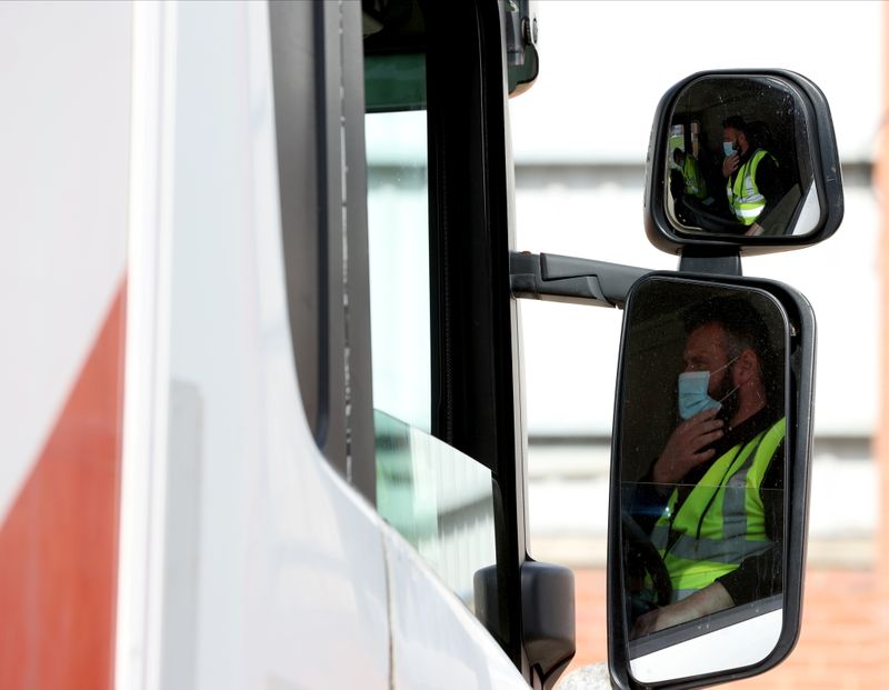 OMA driver under instruction looks on at the LGV Driver