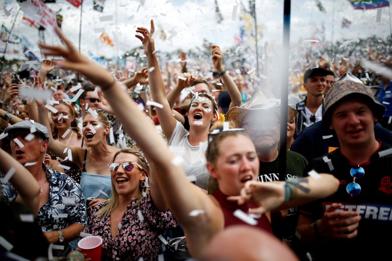 FILE PHOTO: Revellers watch Years & Years performing during the