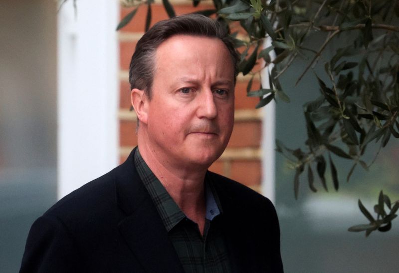 FILE PHOTO: Former British Prime Minister David Cameron leaves his
