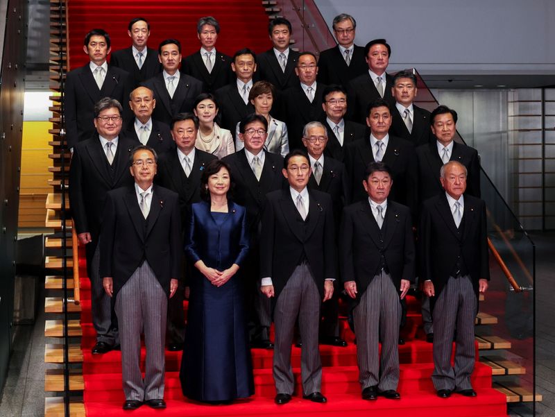 Newly elected Prime Minister Fumio Kishida poses with his cabinet