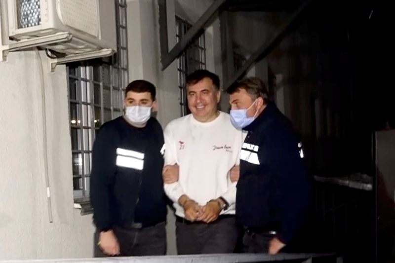 FILE PHOTO: Georgia’s former President Mikheil Saakashvili is escorted by