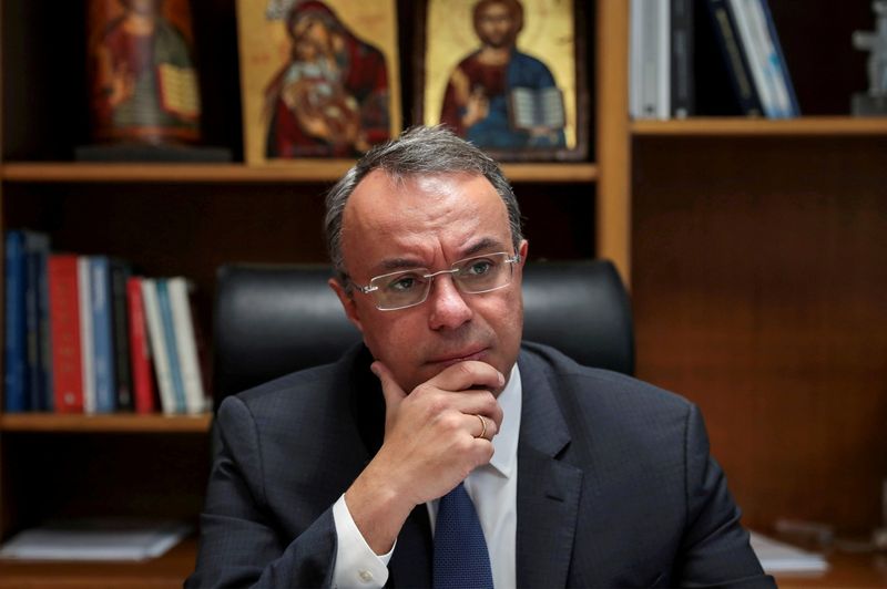 FILE PHOTO: Greek Finance Minister Christos Staikouras pauses during an