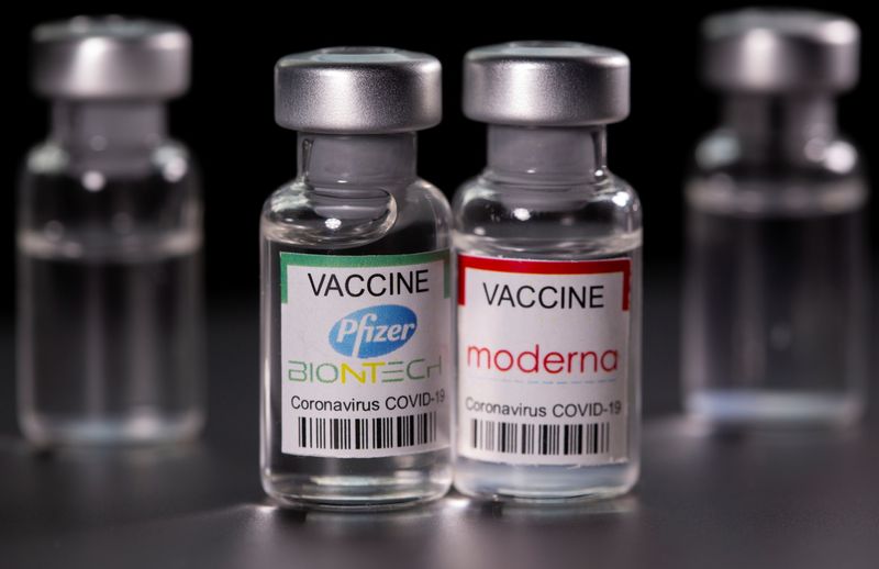 Picture illustration of vials with Pfizer-BioNTech and Moderna coronavirus disease
