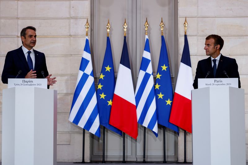 FILE PHOTO: France’s President Macron meets Greek Prime Minister Kyriakos