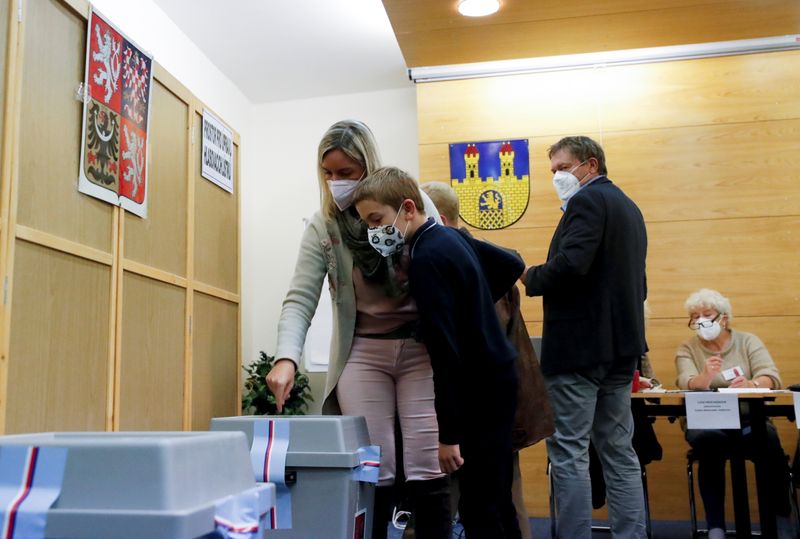 People cast their ballots during the parliamentary elections in Lovosice
