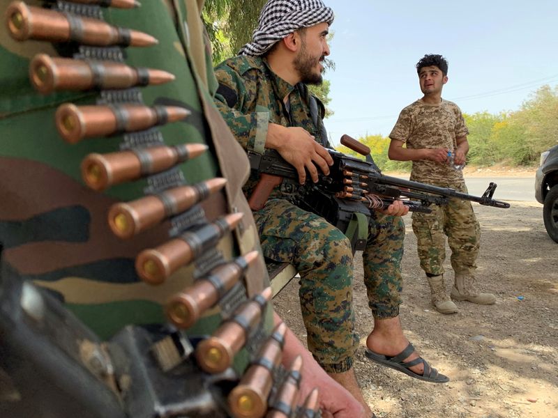 FILE PHOTO: Fighters loyal to Libya’s internationally recognised government are