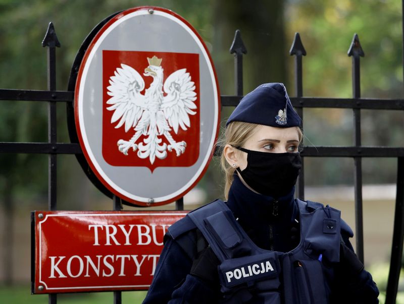 FILE PHOTO: Police officer stands outside Constitutional Tribunal building in