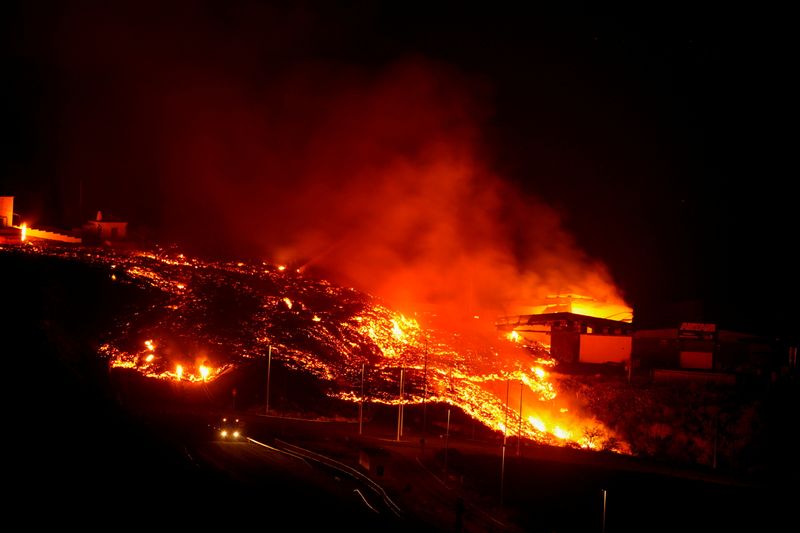 Lava burns buildings following the eruption of the Cumbre Vieja