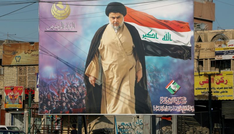 FILE PHOTO: A poster of Iraqi Shi’ite cleric Moqtada al-Sadr