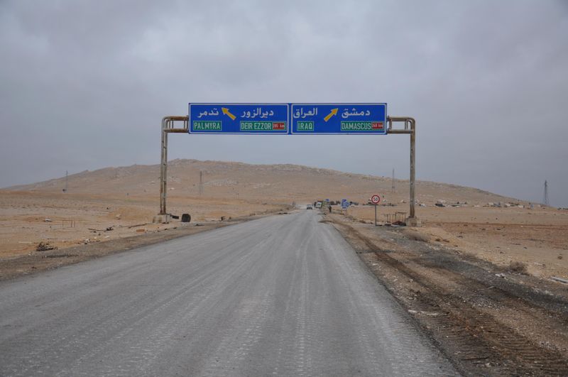 FILE PHOTO: A road sign that shows the direction to