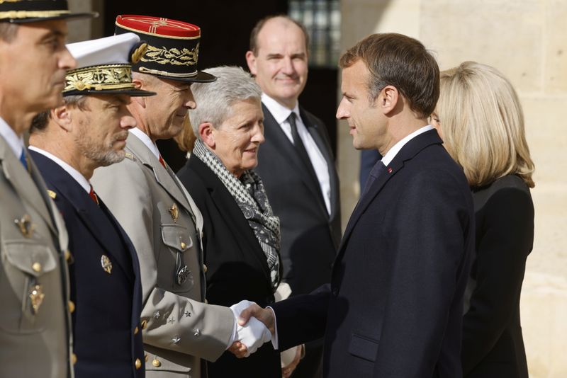 French President Emmanuel Macron attends a national memorial service for