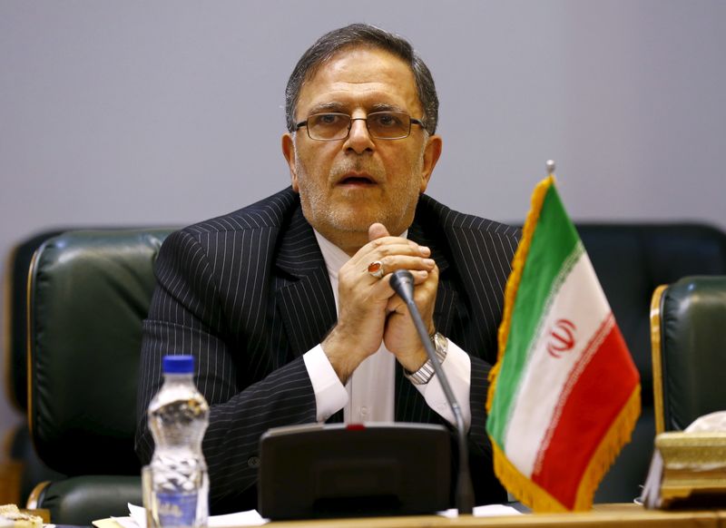 Valiollah Seif, Governor of Central Bank of Iran, waits to