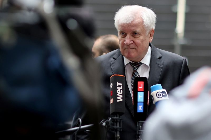 Germany’s Interior Minister Horst Seehofer speaks to the media, in