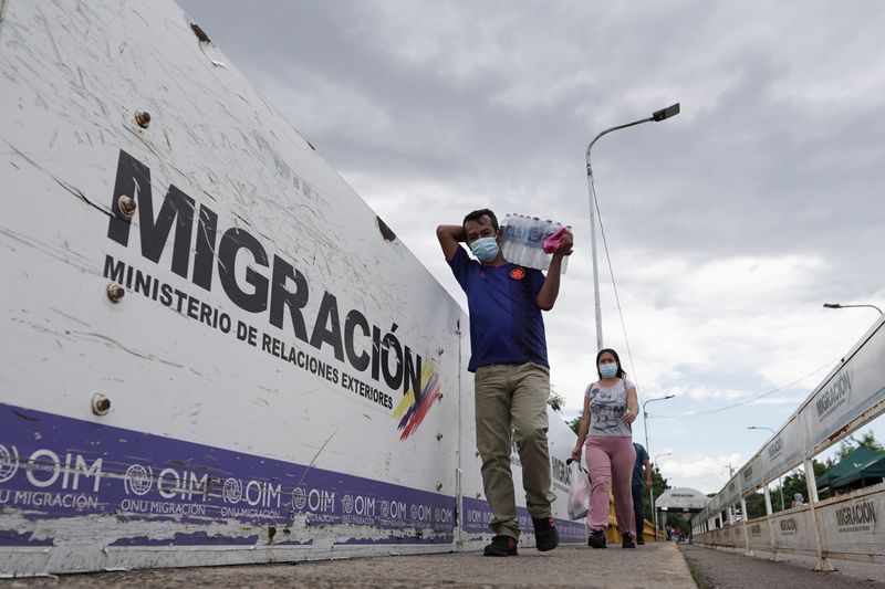 FILE PHOTO: People cross Colombia-Venezuela border, in Cucuta