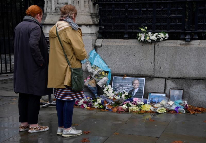 Tributes to British MP Amess placed outside the Houses of