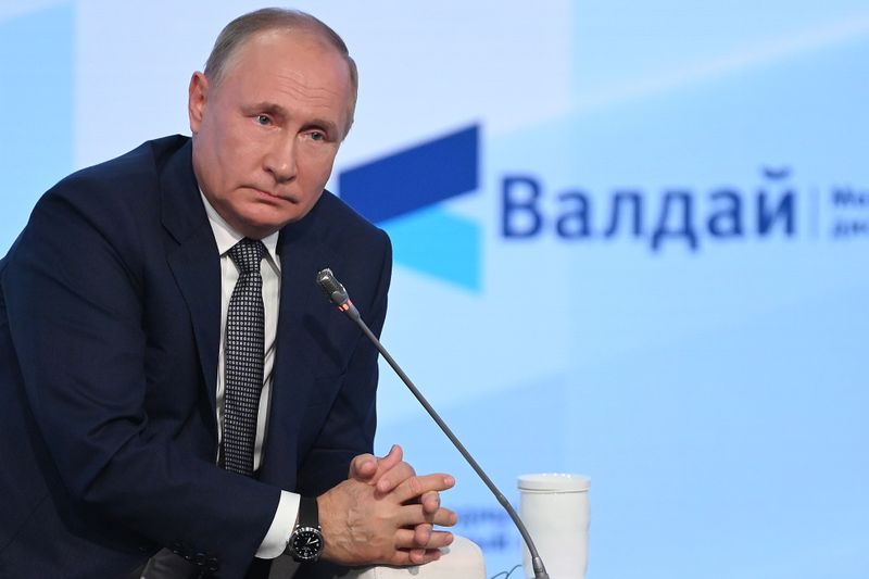 Russia’s President Putin attends a session of the Valdai Discussion