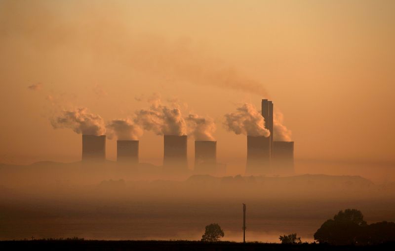 FILE PHOTO: Steam rises at sunrise from the  Lethabo