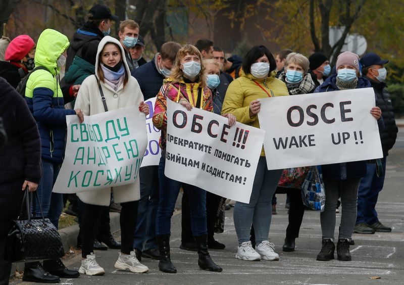 Protesters hold a rally to address OSCE members in Donetsk