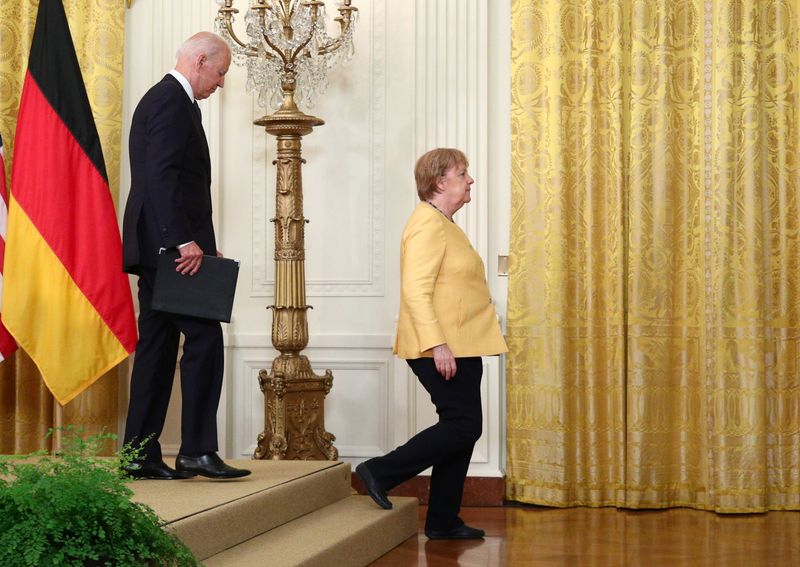 U.S. President Joe Biden and German Chancellor Angela Merkel leave
