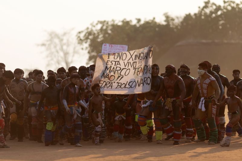 Yawalapiti men take part in a protest against Brazilian President