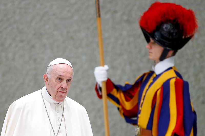 FILE PHOTO: Pope Francis arrives for a meeting at the