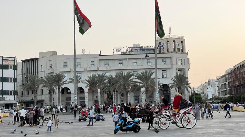 People walk in Martyrs’ Square, Tripoli