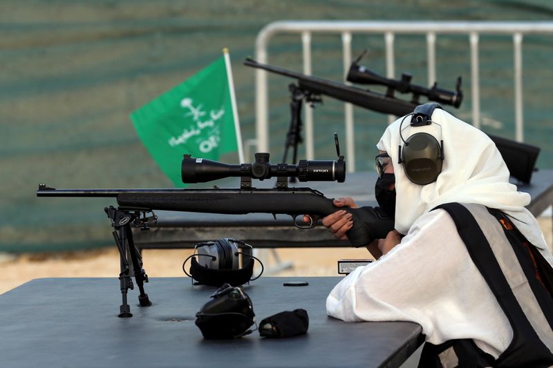 Saudi female firearm trainer takes aim during her target practice