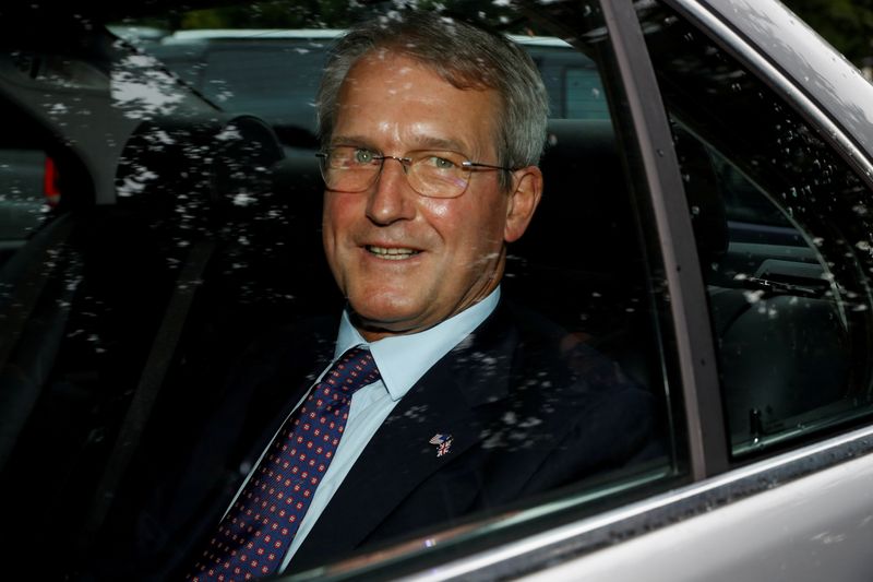 FILE PHOTO: Owen Paterson leaves Winfield House during U.S. President