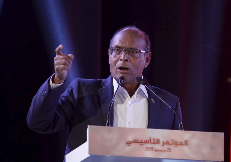Former Tunisian President Moncef Marzouki speaks at a meeting to
