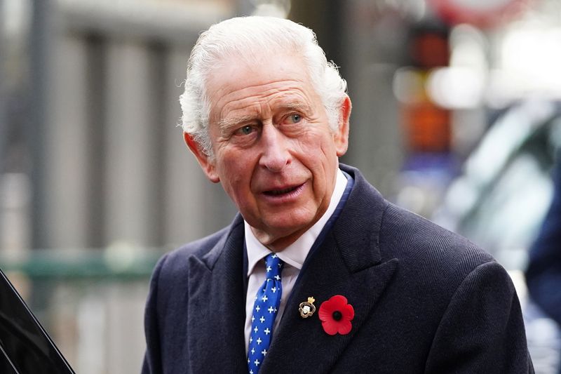 Britain’s Prince Charles views two alternative fuel green trains during