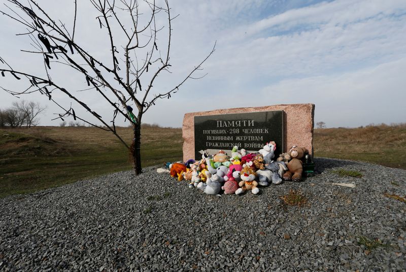 Toys are placed at a memorial to victims of Malaysia