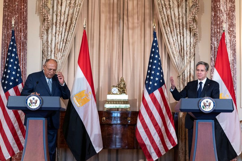 Secretary of State Antony Blinken, right, gestures, to Egyptian Foreign