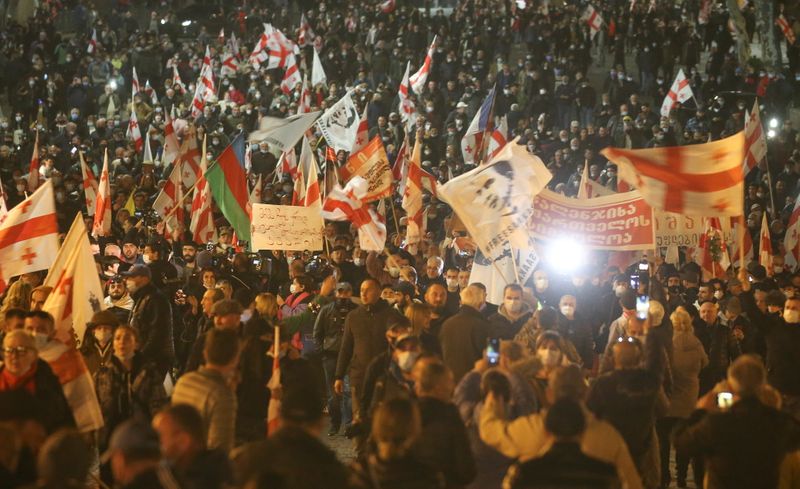 Georgian opposition supporters hold a rally in support of jailed