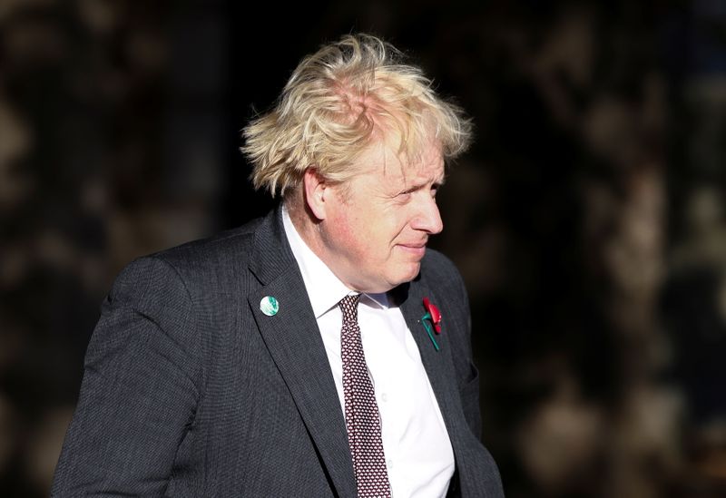 British Prime Minister Boris Johnson leaves an art exhibition on
