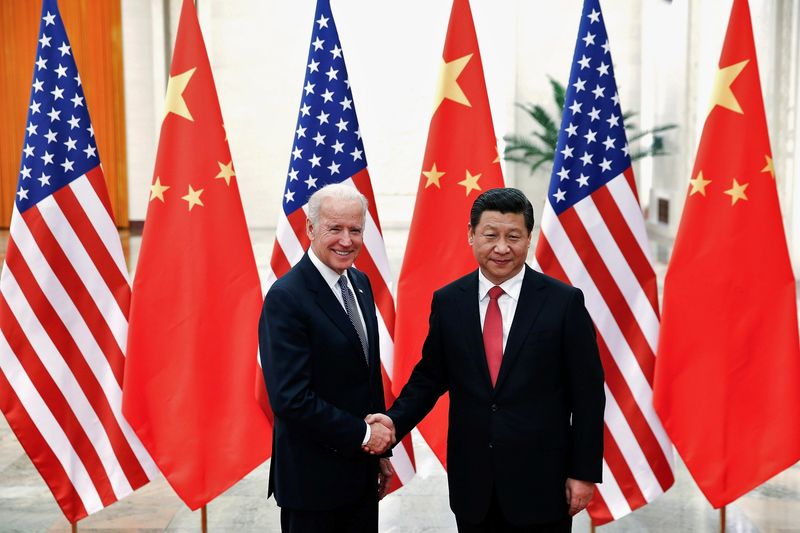 FILE PHOTO: Chinese President Xi Jinping shakes hands with U.S.