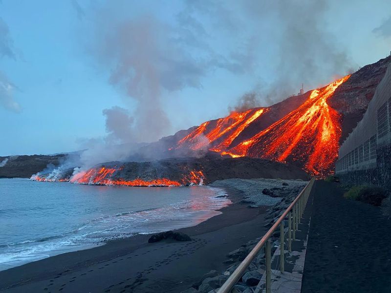 Lava spewed by volcano reaches the Atlantic Ocean at Los