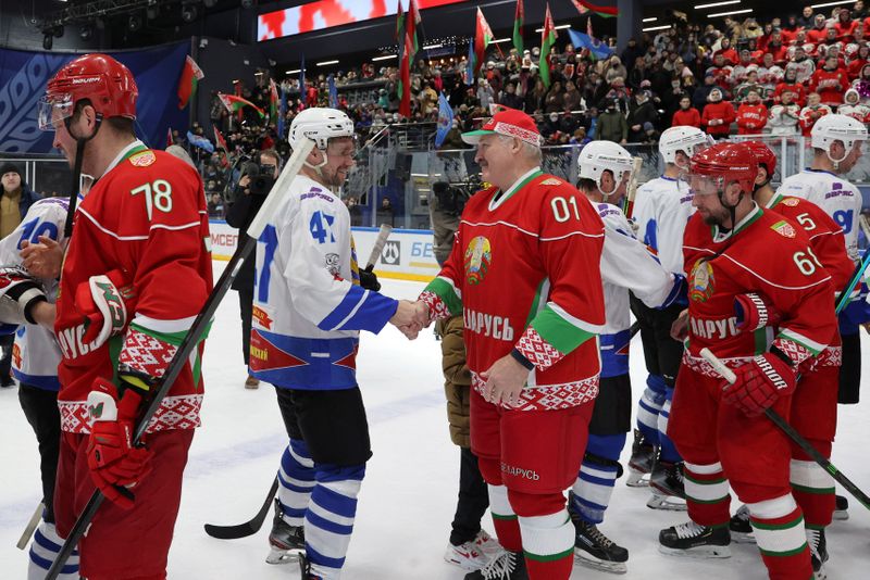 Belarusian President Alexander Lukashenko takes part in a hockey match
